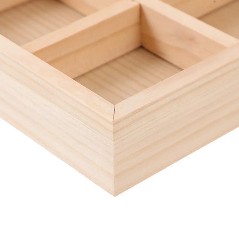 Close-up view of the six compartment pine wood jewelry tray, showcasing its natural finish and divided bins.