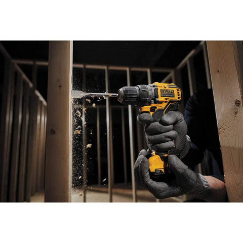 Carpenter using Xtreme 12V Cordless Drill With Three Eighths Inch Chuck Tool Only Brushless Motor for wood drilling in dim light