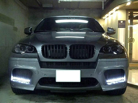 Car with Fits Any Ride LED Daytime Running Light Auto On Off Controller Module, 12W dual output, front view installed