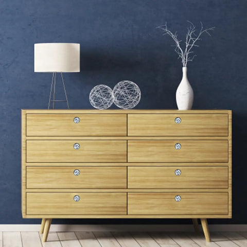 Dang Sharp Black And White Marble Look Round Cabinet Knobs 4 Pack on a wood dresser with soft lamp and decor items.