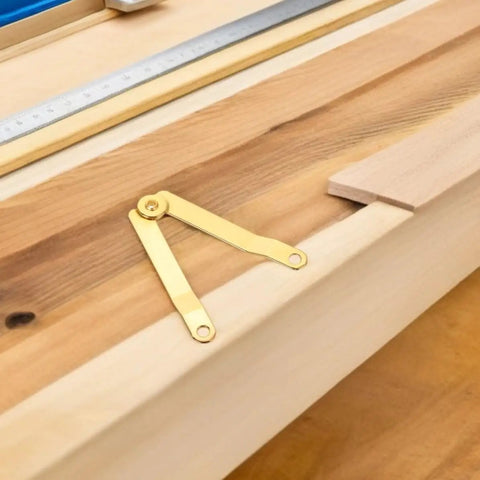 Gold Iron Lid Support Hinges For Small Boxes on wooden surface, heavy duty hinge set for jewelry boxes and treasure chests