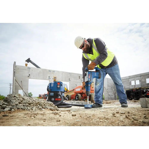 Worker using Heavy Duty SDS Max Rotary Hammer Bit With 100 Percent Carbide Head And Four Cutter Design on construction site
