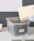 Stackable Clear Plastic Hanging File Box With Snug Snap Lid And Sturdy Side Rails For Letter Legal Documents Sleek Home Office Organizer That Hits Different Daily filled with labeled folders on a desk.