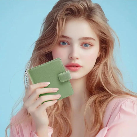 Woman holding a Slim Womens Bifold Wallet With 9 Card Slots, RFID Blocking, ID Window, and Compact Card Holder in Spearmint color