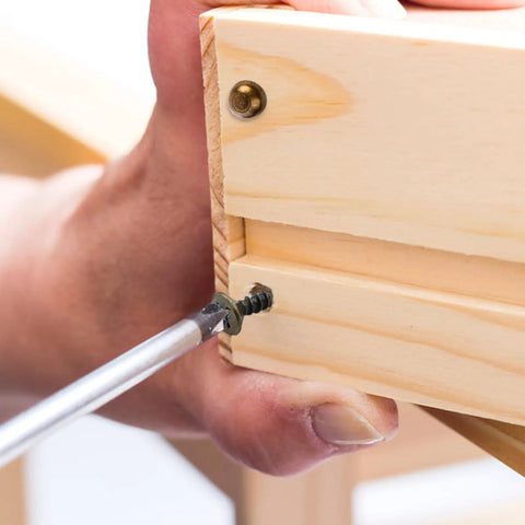 Installing Top Shelf Brass Decorative Screws With Caps For Cabinet Doors And Wood Furniture in a wooden project.