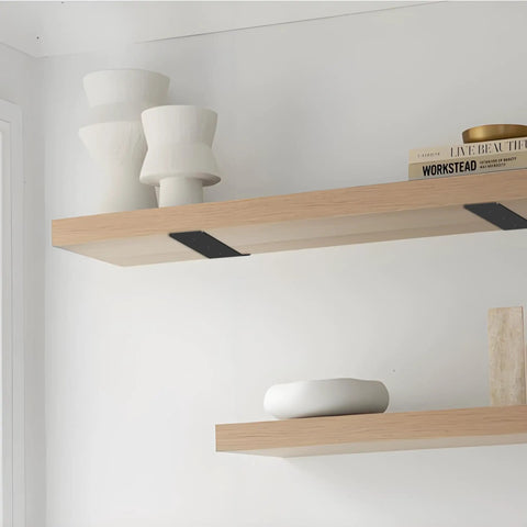 Heavy Duty 6 Inch Floating Shelf Brackets Two Pack Of Bombproof Stainless Steel L Mounts support wooden shelves with decorative items.
