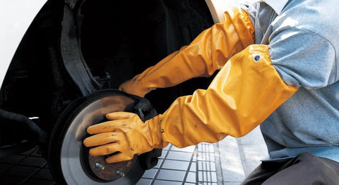 Person wearing Double Nitrile Coated Full Arm Chemical Resistant Safety Glove With Cotton Poly Liner, working on machinery.