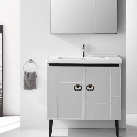 Killer Vintage Antique Bronze Cabinet Pulls Single Hole Ring Handles on bathroom vanity with sleek white finish.