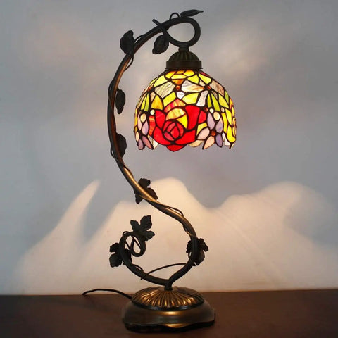 Tiffany Style Red Rose Stained Glass Table Lamp With Bronze Metal Leaf Base 21 Inch Reading Desk Lamp For Bedroom Or Home Office Cozy Vibe 8 Inch Shade UL Listed Cord Switch Easy Assembly Perfect Small Space Decor with lit red rose design