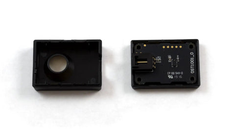 Slick Infrared Time Of Flight Distance Sensor Solid For Makers Delivering Tight Measurements Across Twenty To Sixty Five Millimeter Range With Fast Continuous Data Streams, showing open casing and internal circuitry.