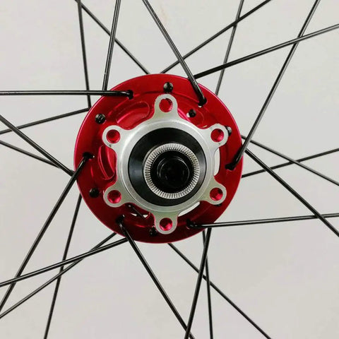 Close-up of red hub on 700C Road Carbon Fiber Fat Ring Disc Brake Wheel Set with 7075 aluminum hubs, 11-speed compatibility
