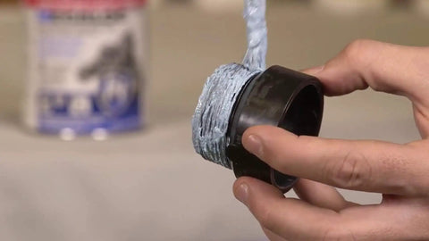 Person applying Megaloc Multi-Purpose Thread Sealant Can Blue Liquid Paste 8 Oz 236 Ml One Half Pint on pipe threads.