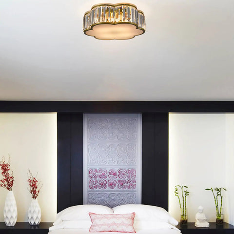 Gold Crystal Flush Mount Ceiling Light With 4 Lights, Modern Brass Frame, Flower Drum Design in elegant bedroom setting.