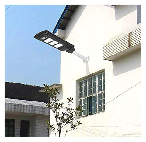 Badass 350W Solar Floodlight With Radar Human Body Induction Dusk To Dawn IP67 Waterproof LED Outdoor Security Light mounted on a wall.