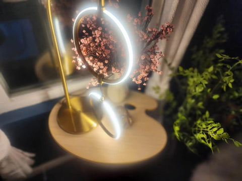 Nova Modern Arc Table Lamp With Two Circle Ring Style Pendant Alexa Compatible Nightstand And Couch Side Light on wooden surface.