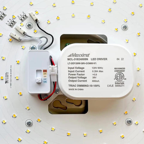 Close-up of LED driver inside 18 Inch LED Flush Mount Ceiling Light In Satin Nickel, Round Fixture, 2000 Lumens, Color Temperature Selectable 2700K To 5000K, showing white enclosure and wiring connectors.