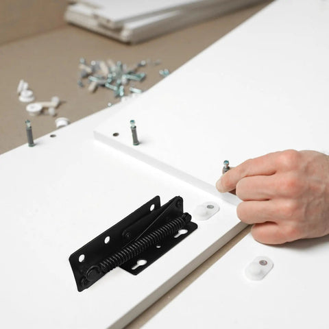 Heavy Duty Steel Spring Loaded Door Hinges With High Hardness And Black Locking for folding sofas installation on white panel.