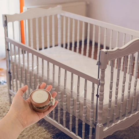 Flex Ride Caster Wheels With Secure Safety Brakes Whisper Soft Swivel Rubber Furniture Casters Lock Down Roll For Baby Bed Cart And Table Universal Fit Zero Hassle in hand next to a baby crib.