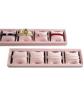 Black Velvet Watch Tray 2 Pack Four Grid Jewelry Organizer With Mini Pillows Bracelet Holder displaying colorful bracelets.