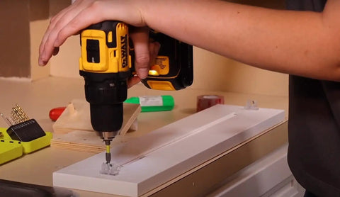 Person assembling cabinet with False Front Cabinet Clips With Screws Kit For Kitchen Cabinets And Drawer Fronts 10 Pairs