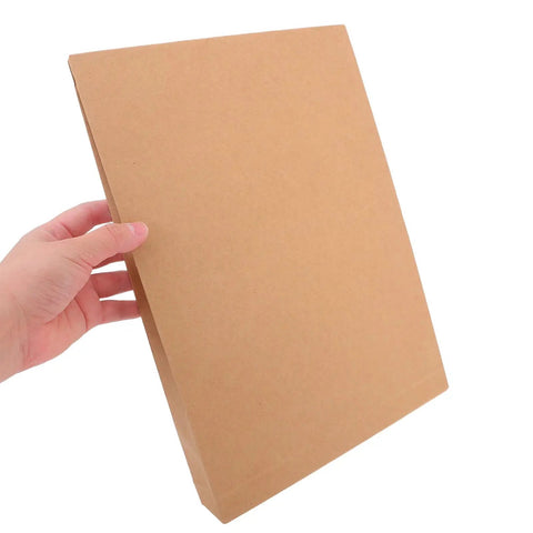 Hand holding Kraft Mailing Envelopes 10 Pack With Double Sided Adhesive Seal Self Sealing Shipping Bags For Documents And Clothes