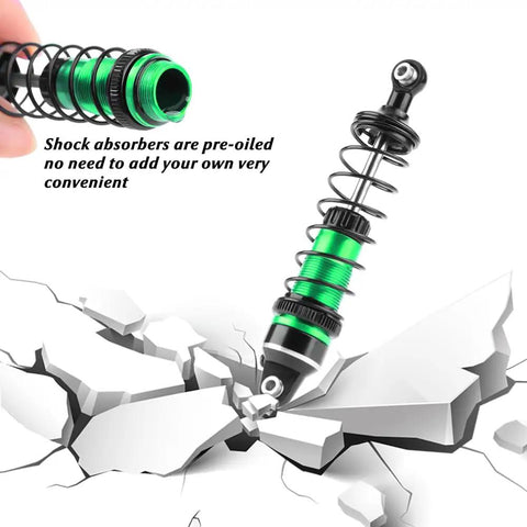 Green aluminum shock absorber cutting through cracked surface, part of Beefed Up Aluminum 87mm Front And Rear Shock Absorber Set