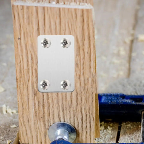 Flat Steel Mending Plate Bracket Set With Screws 20 Pack For Woodworking And Home Improvement attached to wooden board