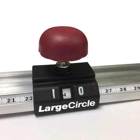 Adjustable Circle Cutting Guide Set Featuring Built Tough Metric And Imperial Scales For No Sweat Precision Cutting With Top Shelf Inside Outside Router Templates For Custom Woodworks, showing locking mechanism with scale.