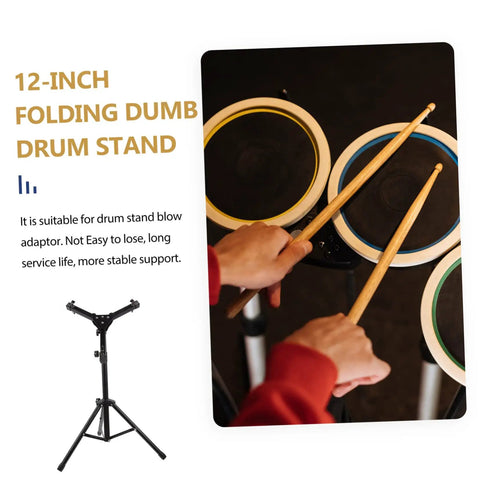 Hella Sturdy 12 Fold Snare Drum Stand Rack With Heavy Duty Accessory Holder For Practice Pads And Gear Compact Road Ready Top Shelf Black Finish, viewed from above with drumsticks on pads.