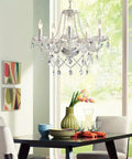 Five Light Modern Crystal Chandelier With K9 Glass Pendants hanging over dining table in elegant room setting