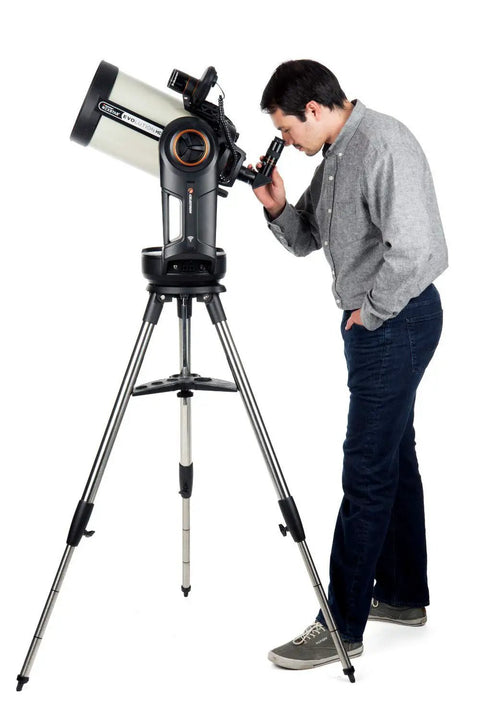 Evolution 8 EdgeHD Schmidt Cassegrain Telescope With StartSense And StarBright XLT Coatings in use by an astronomer with tripod