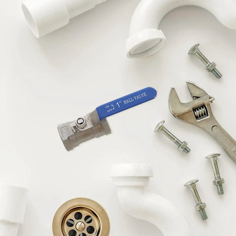 Heavy Duty Stainless Steel Ball Valve With Internal Threaded Fittings For Solid Water Pipe Networks, 1 inch size, with tools and plumbing parts.