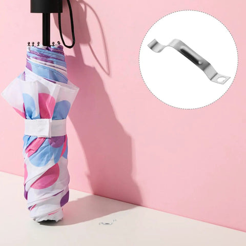 Rock Solid Metal Push Button Spring Clip For Zero Hassle Umbrella Repair And Patio Sun Shade Replacement next to a closed umbrella.