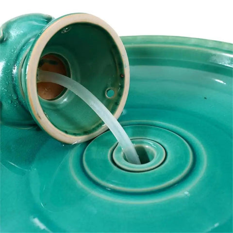 Close-up of 22 Inch Ceramic Bird Bath Fountain With Lotus Design, showing the spout and glazed ceramic in Aqua Green.