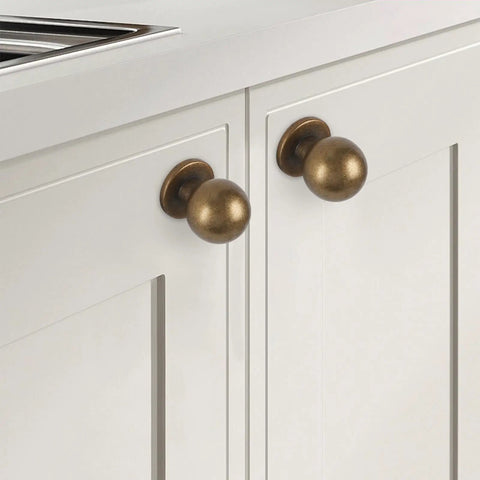 Top Shelf Antique Brass Kitchen Cabinet Knobs And Drawer Pulls Two Pack Sturdy Metal Handles with round design on white cabinets