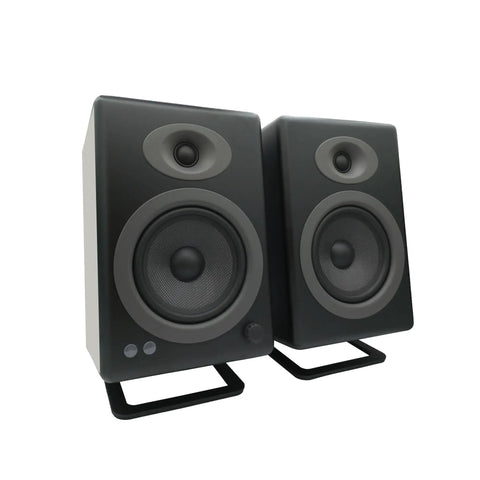 Metal Desk Speaker Stands Pair For Desktop And Bookshelf Speakers With Fifteen Degree Tilt To Boost Soundstage By Twenty Percent Steel Mounts For Gaming And Studio Audio Setup Black Finish showing speakers on stands
