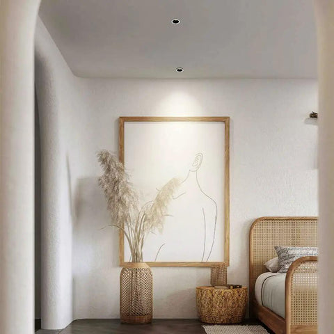Top Shelf Eight Pack LED Downlights Slick Baffle Trim Anti Glare Recessed Spotlights Deep Cylinder Cob Ceiling Lights For Kitchen And Bath 20W 4000K Neutral illuminating a cozy bedroom with artwork.