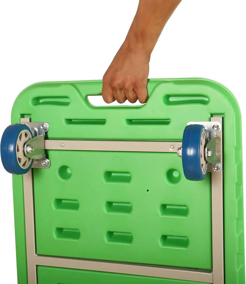 Heavy Duty Folding Flatbed Hand Truck With Four Swivel Casters And Reinforced Steel Bracing being lifted by hand, showing green flatbed and wheel.