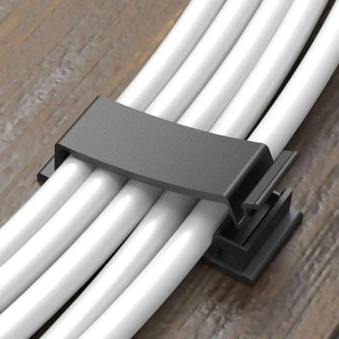 Strong Self Adhesive Cable Clips 20 Pack for Cable Management and Wire Runs holding white cables on a wooden surface