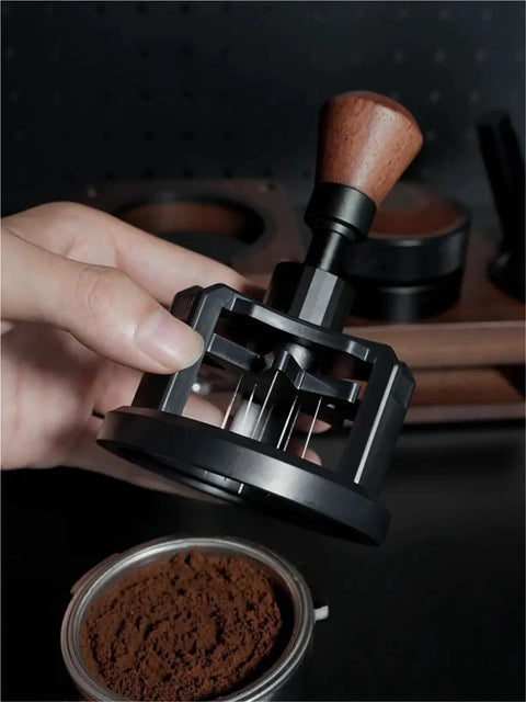 Close-up of Premium Game Changer 58Mm Espresso Coffee Distributor With Magnetic Base over ground coffee.
