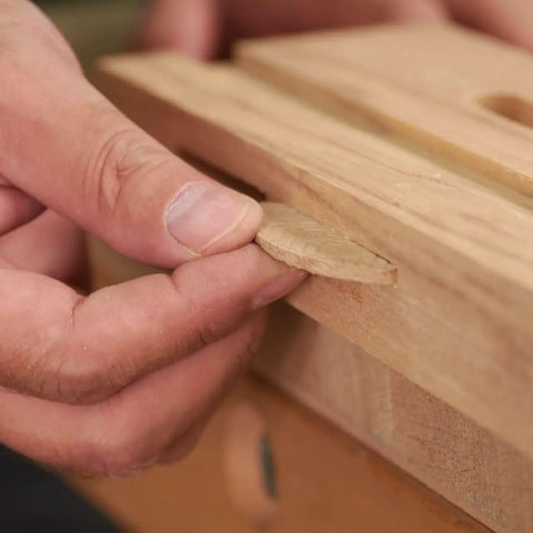 Top Shelf Beechwood Joining Biscuits Pack Of One Hundred No Zero Size for Woodworking, close-up of biscuit being inserted.