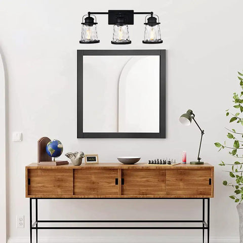 Black 3 Light Industrial Vanity Sconces With Hammered Glass Shades over mirror, stylish rustic farmhouse bathroom lighting.