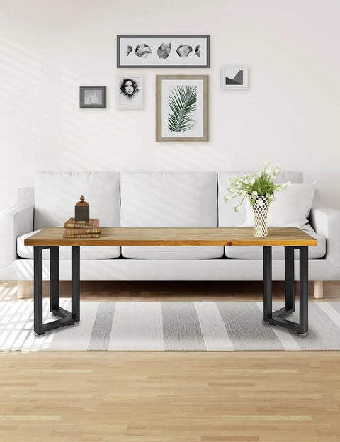 Living room setup with Heavy Duty Iron Dining Table Legs 16 Inch V Shape Black For DIY Tables And Desks holding a wooden tabletop.