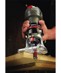Corded Router With 4.5 Amp Motor And 31,000 RPM, Quarter Inch Laminate Trim being used on a wooden board