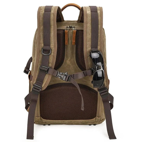 Back view of Waterproof Camera Backpack With Hidden Side Access, Retro Batik Canvas DSLR Shoulder Bag showing straps and sunglasses attachment.