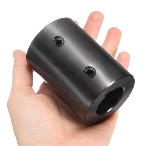 Rigid Shaft Coupling 1-1/8 Inch Bore, 2-1/8 Inch Outer Diameter, 3 Inch Length With Two Set Screws, Black Oxide 1045 Steel in hand