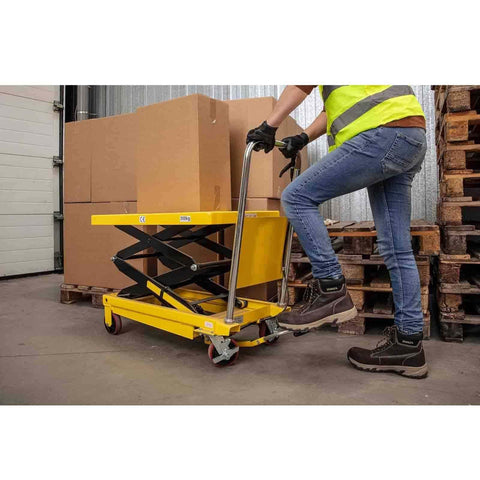 Heavy Duty Pedal Controlled Hydraulic Double Scissor Lift Table With Adjustable Height Platform And Lockable Casters in use, moving boxes.