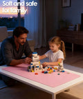Father and daughter playing with blocks on a Leather Desk Protector Mat For Office And Home Large Mouse Pad Non Slip PU Leather Blotter Waterproof Writing Pad Light Pink 23.6 By 13.8 Inches Perfect For Your Laptop Keyboard And Desk Setup