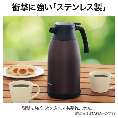 Stainless Steel Vacuum Carafe 1.9 L With One-Touch Pour, Tank-Grade Build For Serious Heat Retention, Unbreakable Steel, Brown, on table