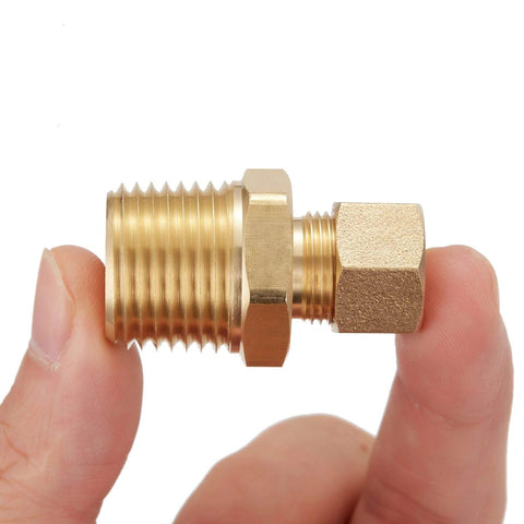 Brass straight compression tube fitting adapter, 3/8 in tube OD x 1/2 in NPT male threads, shown held between fingers